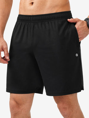 Front lower body shot of model wearing black breathable running shorts with 4 zipper pockets