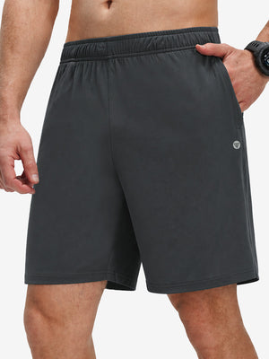 Front lower body shot of model wearing dark grey breathable running shorts with 4 zipper pockets