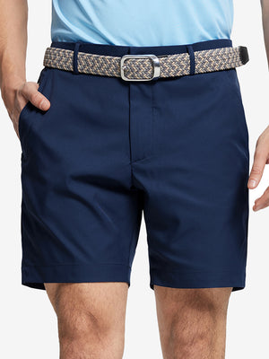 Front waist to knee view of navy water resistant golf 7 inch shorts, clean athletic fit.