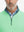 Close-up from nose to chest, showing collar and zipper detail of the light green golf pullover.