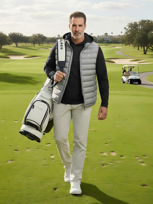 Model carrying a golf bag on the course, dry fit stretchy sweatshirts hoodies in black with sporty look