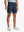 NAVY 4-way Stretch Performance Solid Shorts, golfer front lower body with club, 7 Inch view