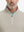 Close-up from nose to chest, showing collar detail and zipper of the khaki light golf vest.