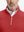 Close-up from nose to chest, showing collar and zipper detail of the red golf pullover.