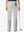 Back lower body shot of model wearing silver grey women's regular fit stretchy golf pants