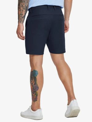 Back lower-body view of model in NAVY Water Resistant Versatile 8 Pockets Shorts.