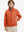 Boys windproof puffer jacket with pockets in orange, model front upper-body with one hand in pocket.