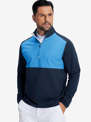 Model front upper body wearing Fleece lined golf quarter zip with sleek navy/blue look