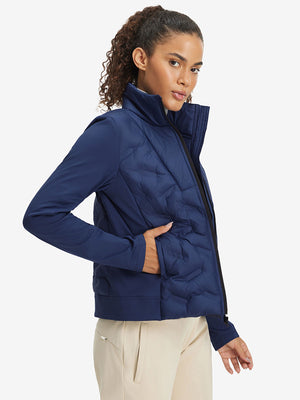 Model wearing women's lightweight fleece-lined puffer jacket, navy, front upper-body look.