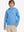Model front upper body with one hand in pocket, stylish youth full print hoodies pullover in bluejay navy dogs.