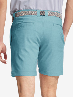 back view of youth in blue light Heather Performance Golf Shorts, highlighting rear design and fit