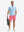 Full-body front view of model wearing the peach pink stretch soft flat front dress golf shorts for a complete look