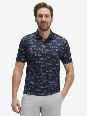 Front half-body shot of model wearing the ombre shark 4 way stretch print collared polo shirt for a casual sporty look