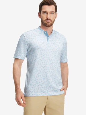 Front half-body of model in white blue florals stretch printed collarless henley golf shirts