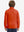 Model in kids soft lightweight fleece lined jacket in orange, showing back half-body view.