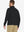 Back upper-body view of quarter zip melange pullover on model, shown in black.