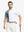 Half-body front view of model holding golf club wearing WHITE Moisture Wicking Color Block Polo Shirt.