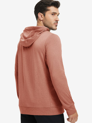 Back upper body view of the brick melange classic heather hoodie, model turns head slightly with ease.
