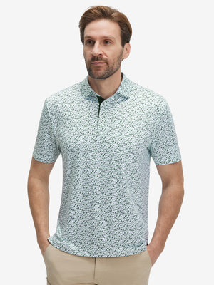 Front half-body shot of model wearing the green forest 4 way stretch print collared polo shirt for a casual sporty look