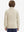 Model in kids soft lightweight fleece lined jacket in light khaki, showing back half-body view.