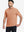 Front half-body shot of model wearing the orange adobe heather comfy cotton blend polo shirt with pocket for a casual relaxed look