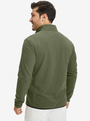 Back upper view of model in midweight warm stretchy quarter zip pullover, highlighting shoulder fit in green.