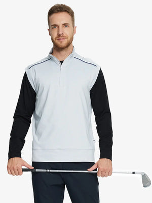 Half-body front view of model holding golf club wearing GREY MIST Stretch Solid Fleece Quarter-Zip Vest.								
