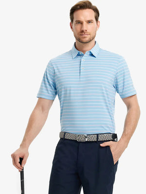 Model in MISTY BLUE STRIPE Golf Polo holding club — dynamic front half-body pose
