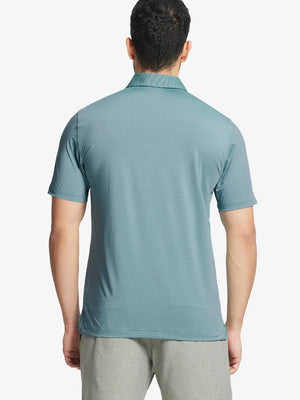 Back half-body view of GREEN ASH STRIPE Pinstripe Jersey Performance Polo worn by model								
