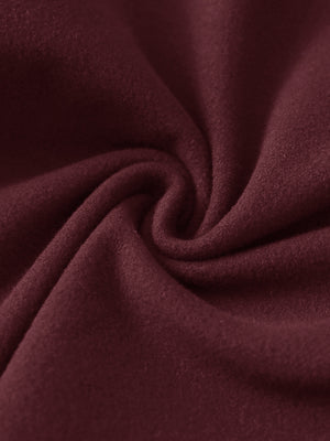 Close-up of the fabric of women's stretch fleece lined water resistant joggers in wine, highlighting the fleece lining.