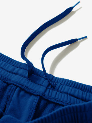 Close-up of the waistband with drawstring detail of klein blue fleece stretch water resistant boys joggers.