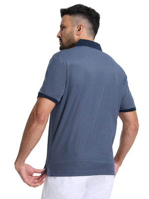 Back half-body shot of model wearing the blue quick dry jacquard ribbed collar golf shirt
