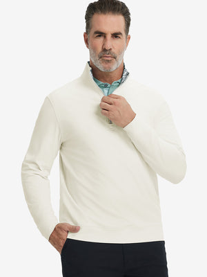 Front upper body view of model wearing lightweight golf quarter zip pullover in cream, relaxed fit.