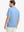 Back half-body view wearing Everyday Collarless Jersey Shirt in LIGHT BLUE.