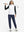 Model holding golf club full body, women's lightweight slim-fit puffer vest styled in sporty white