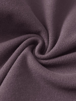 Close-up of the fabric of women's stretch fleece lined water resistant joggers in light pinkish purple, highlighting the fleece lining.