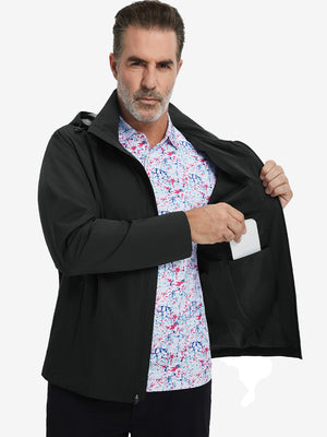 Model placing an iPhone into the inner pocket of the lightweight water-repellent softshell hooded jacket in black.