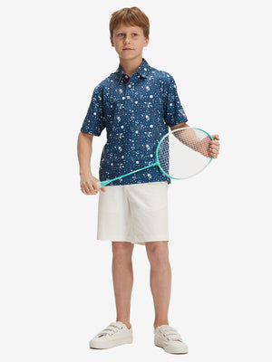 Full front: boy in space rocket performance print boys golf polo holding sports gear.