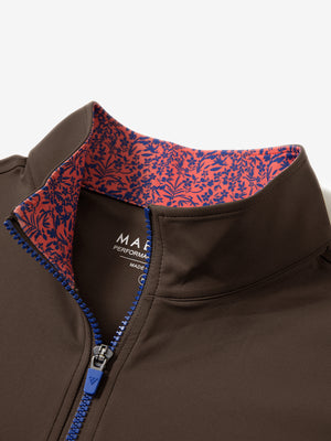 Collar zipper and inner neck pattern detail of the lightweight golf quarter zip pullover in coffee brown.