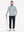 Man wearing Heather Pinstripe Brushed Dry Fit Quarter Zip Pullover in lunar rock melange, holding golf club on course