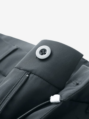Waist detail of quick dry casual dress pants in dark grey, featuring button and zipper design.