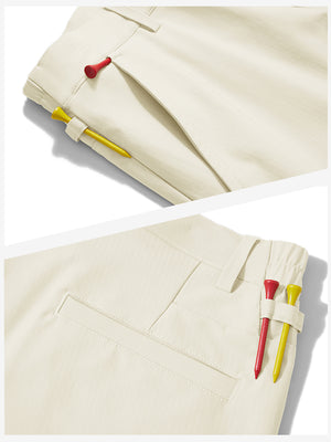 Waistband detail of lightweight flat front casual trousers in beige, showing clean stitching.
