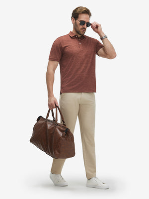 Full-body shot of model holding a golf briefcase in red flower breathable jacquard pattern 3-button golf polo