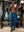 Full-body view of model in gym wearing BLUE INDIGO Performance Tapered Sports Joggers