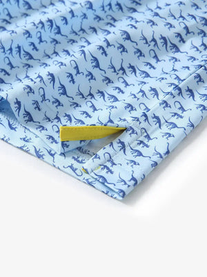 Detailed close-up of side hem slit on BLUE DINOSAUR Performance Print Boys Golf Polo for comfort