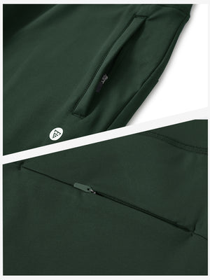 Detailed view of the front side pocket on women's stretch fleece lined water resistant joggers in forest green, showing stitching and design.