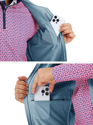 Close-up detail showing phone in the pocket of sleeveless softshell fleece outdoor vests with 6 pockets in misty blue