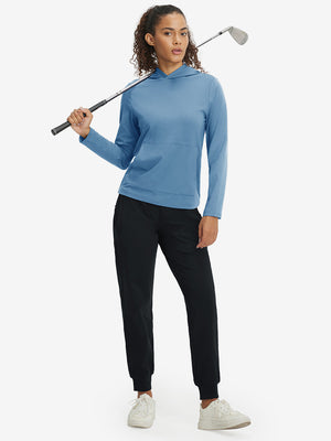 Model holding golf club, dressed in women's lightweight hoodies pullover in misty blue.