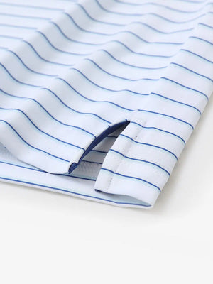 Hem slit detail of WHITE/LIGHT BLUE STRIPE Youth Performance Golf Polo highlighting stitching and finish.