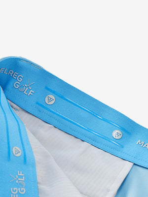 Inside waistband detail of water-resistant golf stretch nylon pants featuring maelreg logo, light blue.